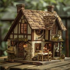 a doll house sitting on top of a wooden table