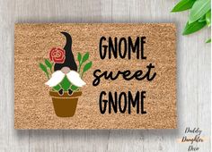 gnome door mat with the words gnome sweet gnome and a potted plant on it