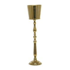 a gold colored candle holder on a white background