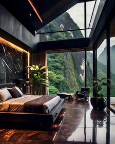 a large bed sitting in the middle of a bedroom next to a tall mountain range