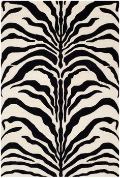 a zebra print rug with black and white stripes