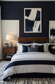 a bedroom with blue walls and white bedding in the center is decorated with art