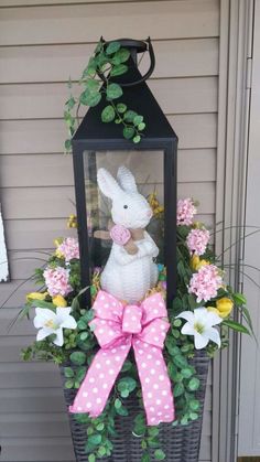 a basket filled with flowers and a stuffed bunny