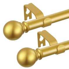 pair of gold door handles with ball and bracketes on each side, isolated against a white background