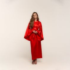 Ankle length, wrap-over style, with two sets of inside ties. One tie is included. Material Composition: polyamide 60%, viscose 20%, polyester 10%, silk 7%, elastane 3% Red Robe Silk, Luxury Red Kimono With Kimono Sleeves, Elegant Red Lounge Robe, Red Cotton Long Sleeve Robe, Obi Style, High-end Red Kimono With Kimono Sleeves, Flared Sleeves, Bright Red, Ankle Length