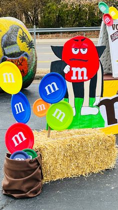 a hay bale filled with lots of different types of magnets on top of it