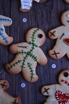 several decorated ginger cookies on a wooden table