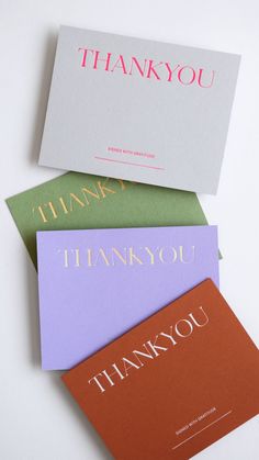 three thank you cards sitting on top of each other