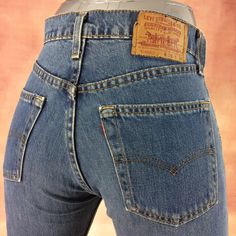 "Size 27 Vintage Levis 519 Distressed Medium Wash Red Tab Jeans W27 L31 High Waisted Straight Leg 90's Classic Mom Jeans Girlfriends Boyfriends Jeans Made In USA Brand: LEVIS 519-0217 Size On Tag marked W28 L36 but fits more like 27\" waist, 11.75\" rise, 23\" thighs, 40.5\" hips, 31.5\" inseam, 16\" leg opening! Fits a size 27, but check your measurements and compare the measurements with your garment. (see full measurement below) Recommended waist size: 27\" (27x31.5) *size 27 for a waist of 27 inches, expect your jeans to measure about 13.5\" across at the waist (Doubled 27\") to fit. Please follow our measurement guide: https://www.instagram.com/p/B2o273Kl5Oi/?igshid=1q5azikfj59p4 Material :  Cotton 100% Red Tab Made In USA Measurements:- All measurements are taken with the garment lay 90s Fitted Bottoms With Belt Loops, Vintage Full-length Fitted Bottoms, 90s Style Fitted Straight Leg Bottoms, 90s Fitted Straight Leg Bottoms, 90s Fitted Bottoms With Pockets, Retro Fitted Red Jeans, 90s Style Fitted High Rise Pants, Vintage High Waist Fitted Bottoms, Fitted High Waist Vintage Bottoms