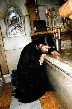 a man sitting at a counter in a church