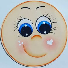 a close up of a plate with a face painted on it