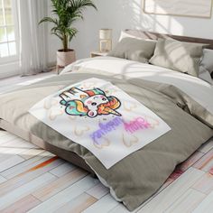 a bedroom with a bed covered in an unicorn pillow case and pillows on the floor