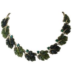 Vintage emerald oak leaf necklace by Lisner, 1960s Currently, one of the most coveted vintage Lisner lines is the molded plastic oak-leaf jewelry, which was only produced for five years in the 1960s. Classic Lisner Lucite necklace. Featuring green Lucite leaves made of translucent Lucite and emerald color rhinestones set in gold tone metal, this vintage choker is hard to find. Featured on the cover of antiques and collecting magazine about 10 years ago, the oak leaf collection by Lisner is etern Vintage Emerald Earrings, Oak Leaf Jewelry, Collar Verde, Oak Leaf Necklace, Leaf Collection, Fashion Boards, Ivy Leaves, Costume Jewelry Sets, Vintage Choker