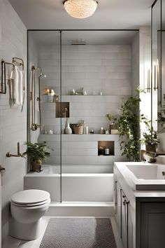 a bathroom with a toilet, sink and bathtub next to a shower stall filled with plants