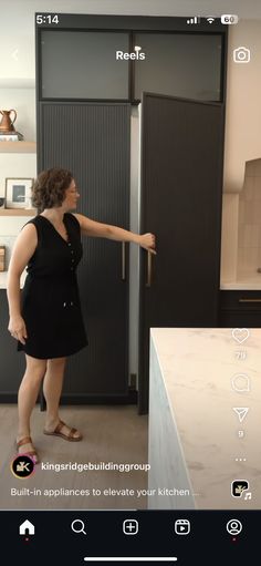 a woman standing in front of a refrigerator freezer next to a kitchen counter top