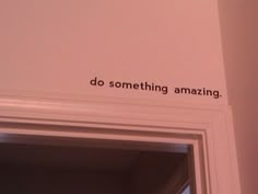 a bathroom door with the words do something amazing written on it's side wall