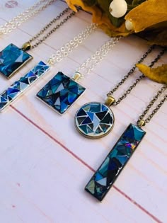 Design your own mosaic necklace! Each necklace is made from tiny shards of blue stained glass. Every pendant is made from a variety of different shades and textured glass including Van Gogh and iridescent! No two pendants are the same, so you will be wearing a one of a kind piece. You will get to Mosaic Birdhouse, Stained Glass Necklace, Micro Mosaic Jewelry, Mosaic Jewelry, Stained Glass Jewelry, Mosaic Stained, Handmade Mosaic, Blue Stain, Stained Glass Diy