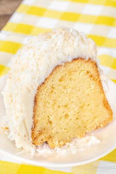 a piece of cake with white frosting on a plate