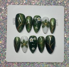 Hand made custom gel press on nails.  These nails are made to order specially for you! Whether you want to go the extra mile for a special event, or just want to feel fancy in your day to day life, these precious custom press on nails are for you. Inspired by the green nature, and flowing waters of Thailand, these nails bring me back to one of my favorite vacation memories. Cat eye polish layered with green jelly give a unique shimmering effect. The 3d aspect of the middle nail gives the illusion of flowing water, and the 3d hand carved flower on the ring finger makes this set super unique. You will surely get compliments on this set!   Please note picture with instructions on how to measure your nails.  See instructions when choosing "custom" in size options Pretty Green Nail Designs, Green 3d Nail Art, Very Natural Nails, Green Mushroom Nails, Green Cat Eye Nails Design, Nails Green Design, Green Cat Eye Nails, Cat Eye Polish, Green Cat Eye