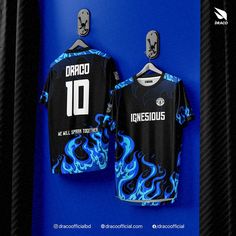 a black and blue soccer jersey hanging on a wall with the number 10 printed on it