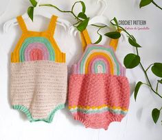 two crocheted baby swimsuits hanging on a plant