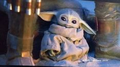 a baby yoda in a star wars costume