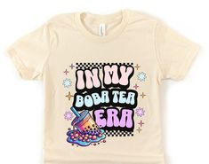 Introducing our adorable and vibrant youth-sized Boba Shirt, perfect for young boba tea enthusiasts! This brightly colored tee features wavy retro text that reads "IN MY BOBA TEA ERA," making it a fun and trendy addition to any child's wardrobe. Designed with comfort and style in mind, this shirt is made from soft, high-quality fabric that ensures all-day comfort. It's the ideal shirt for any girl who loves boba, whether she's enjoying a fun outing with friends or expressing her unique style at school. This shirt also makes a fantastic gift for birthdays, holidays, or just because. The playful design and bright colors are sure to bring a smile to any boba lover's face. Perfect for any occasion, it's a must-have for the young boba tea fan in your life. Embrace the "In My Boba Tea Era" vibe Boba Birthday, Cute Bubble Tea, Retro Text, Tea Shirt, Shirt Girl, Boba Tea, Bubble Tea, Cozy Fashion, Shirt Ideas