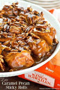 caramel pecan sticky rolls in a white bowl