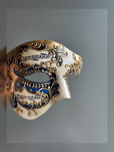 This phantom of the opera-themed half-face Venetian style mask in blue is perfect for any formal occasion or masquerade event! Thank you for supporting small businesses and hope our products bring you and loved ones some joy and humor in these trying times.    I N C L U D E D Masks come with matching double sided satin ribbons attached. S I Z E  Adult size. Detailed dimensions available upon request. C U S T O M I Z A T I O N If you would like to color & embellish the mask to match your costume/ Masqurade Mask, Masquerade Event, Mask Half Face, Elegant Face Mask, Phantom Mask, Face Mask Halloween, Halloween Fiesta, Nota Musical