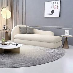 a living room filled with furniture and a rug on top of a white floor next to a window