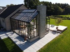 an aerial view of a house with glass walls