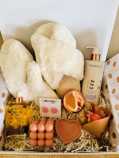 an assortment of items in a box including soaps, eggs, and other things