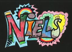 the word nez written in colored chalk on a black background