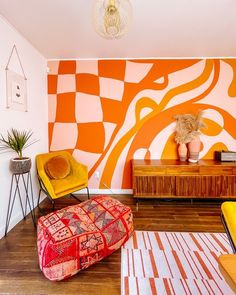 a living room with orange and white walls