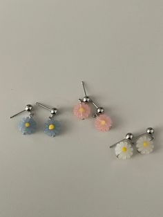 Fun, quirky, and full of personality - these acrylic resin dangle earrings feature charming daisy flowers and come in your choice of gold or silver earring posts. Choose your preferred flower dangle color to add a touch of playfulness to any outfit.- Stainless steel, Acrylic Resin- Daisy: 10x10mm- Stud ball: 4.8mm Trendy Nickel-free Flower Earrings, White Daisy Flower Earrings For Spring, Cute Hypoallergenic Flower Shaped Earrings, Cute Hypoallergenic Flower Earrings, Dainty White Flower Earrings For Spring, Dainty 3d Flower Earrings, White Nickel-free Flower Earrings For Spring, White Nickel Free Flower Earrings For Spring, Spring White Nickel-free Flower Earrings