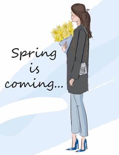 a woman holding flowers in her hand with the words spring is coming