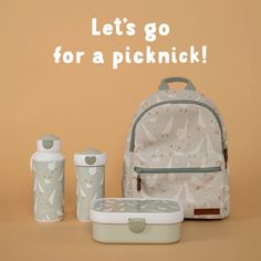 a backpack, bottle and cup with the words let's go for a picknickk