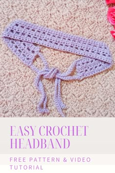 an easy crochet headband is shown on the floor with flowers around it