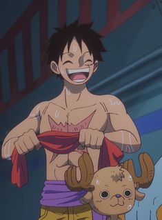 an anime character with no shirt on standing next to a stuffed animal in front of him