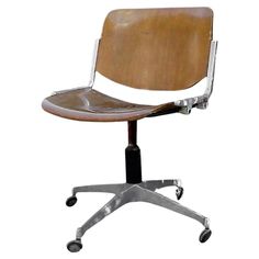 an office chair with wheels and a wooden seat