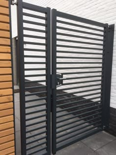 an iron gate with wooden slats on it