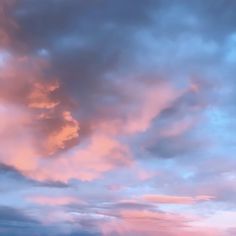 the sky is pink and blue with clouds