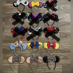 several mickey mouse ears are arranged on the floor with hair clips attached to their ears