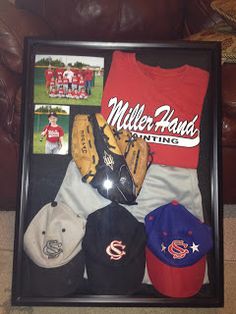 a framed photograph with baseball caps and mitts