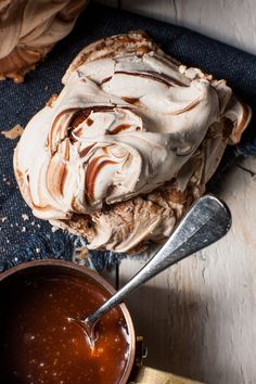 a bowl of ice cream next to a spoon