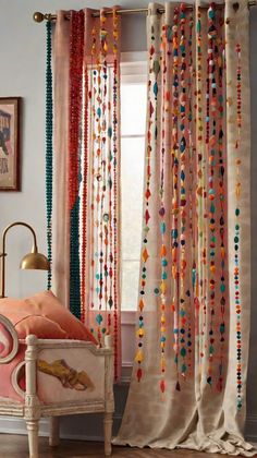 the curtains in this room are decorated with beads