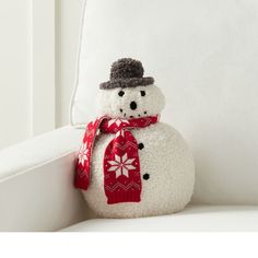 a snowman sitting on top of a white couch