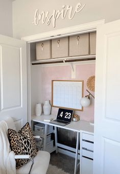 a white desk with a laptop on top of it in a room filled with furniture