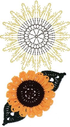 two crocheted sunflowers are next to each other