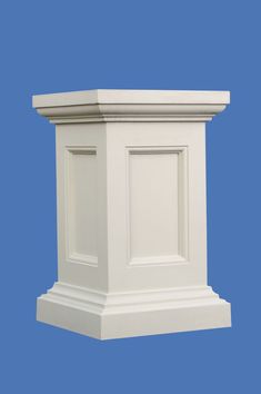 a white pedestal on a blue background